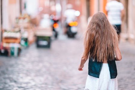 Adorable fashion little girl outdoors in European city Romeの写真素材