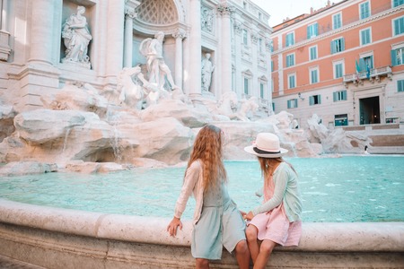 Adorable little girls near the Fountain of Trevi in Rome.の写真素材