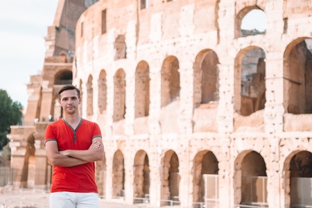 Young hipster man in front of Colosseumの写真素材