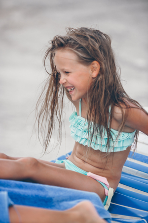 Portrait of beautiful girl on the beach dancingの写真素材