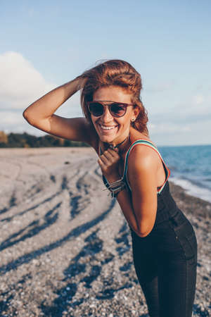 Beautiful happy woman on the beach smilingの写真素材