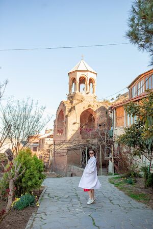 Beautiful woman tourist walking in old Tbilisi, Georgia
