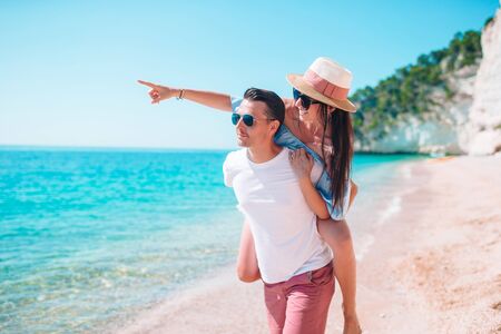 Young couple on white beach during summer vacation.の写真素材