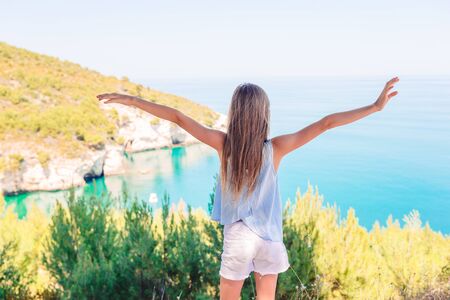Little girl on vacation travel background beautiful landscapeの写真素材