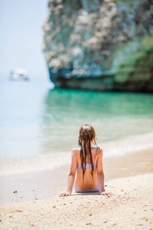Cute little girl at beach during summer vacationの写真素材