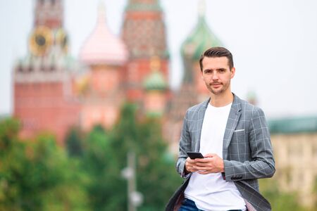 Happy young urban man in european city.の写真素材