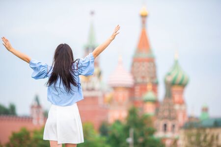 Happy young urban woman in european city.の写真素材