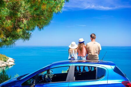 Summer car trip and young family on vacationの写真素材