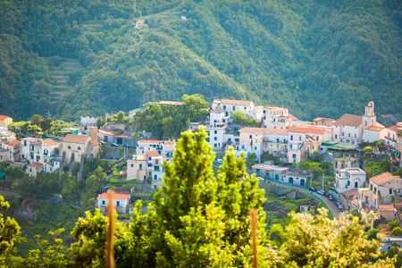 Beautiful cozy bay with small houses on the hill in Italy on Amalfi coastの写真素材