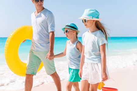 Happy beautiful family on a tropical beach vacation