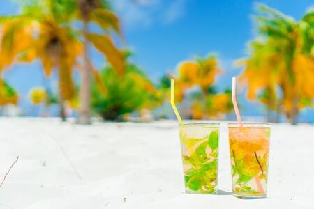 Two tasty cocktails on tropical white beach