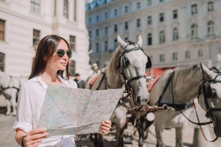 Woman walking in city. Young attractive tourist outdoors in italian city