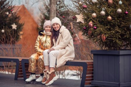 Family winter sport. Mother and daughter on winter day