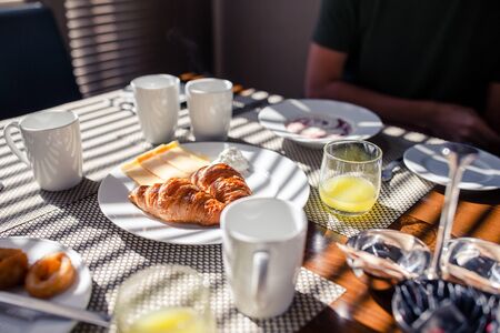 Fresh and delisious breakfast in hotel restaraunt. Delicious tasty croissants and fresh juice for breakfast at outdoor cafeの写真素材