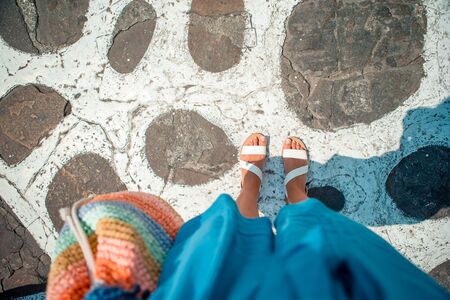 Close-up of female foot in the shales outdoorsの写真素材