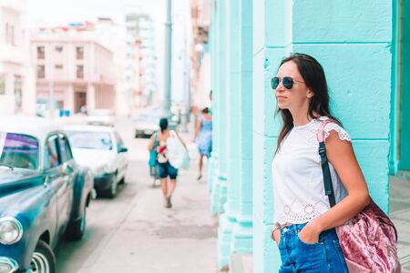 Tourist girl in popular area in Havana, Cuba.View of young woman travelerの写真素材