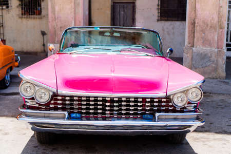 View of yellow classic vintage car in Old Havana, Cuba