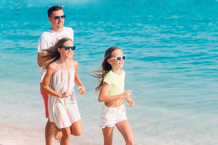 Father and kids enjoying beach summer vacation