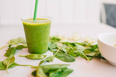 Row of healthy fresh fruit and vegetable smoothies with assorted ingredientsの写真素材