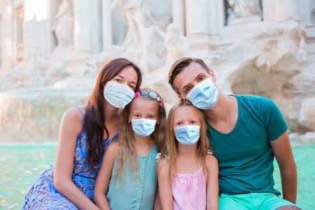 Happy family near Fontana di Trevi with city mapの写真素材