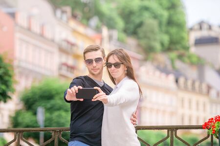 Young tourist couple traveling on european holidays outdoors in italian vacation in Cinque Terreの写真素材