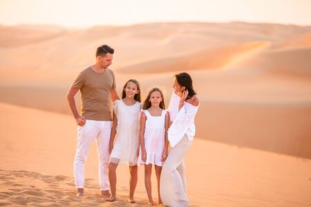 People among dunes in Rub al-Khali desert in United Arab Emiratesの写真素材