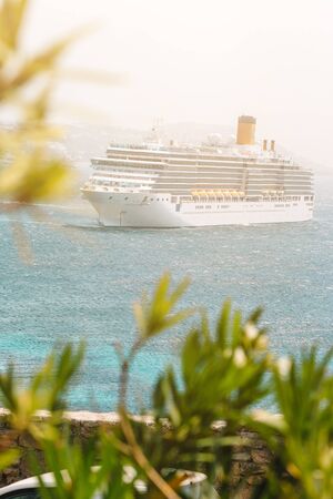 Cruise ship near the Mykonos island, Cyclades in Greece.の写真素材