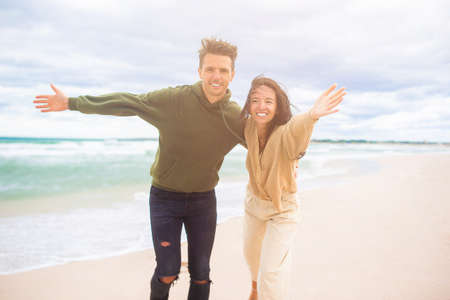 Young couple on white beach during summer vacation.の写真素材