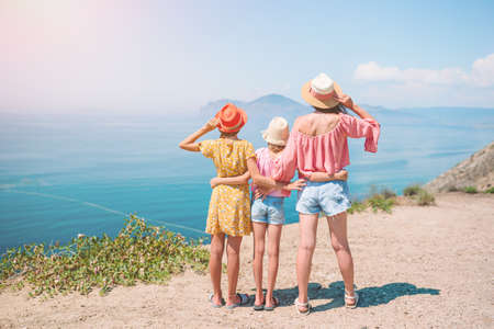 Happy beautiful family on a tropical beach vacationの写真素材