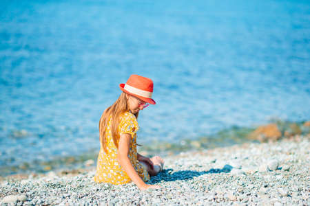 Cute little girl at beach during summer vacationの写真素材