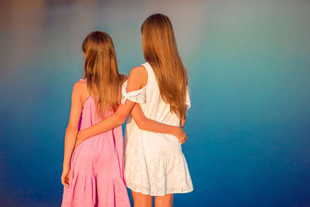 Children outdoor on edge of cliff seashore
