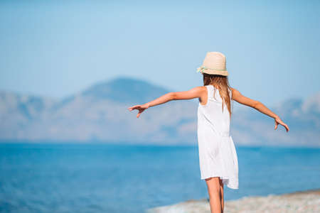 Cute little girl at beach during summer vacationの写真素材