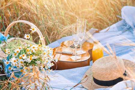 Closeup of picnic on nature in wheat field.の写真素材