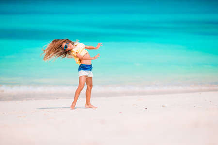 Cute little girl at beach during caribbean vacationの写真素材