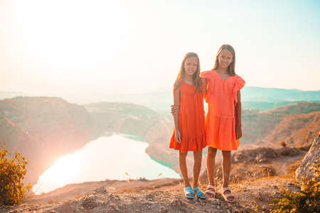 children on vacation on white rock background