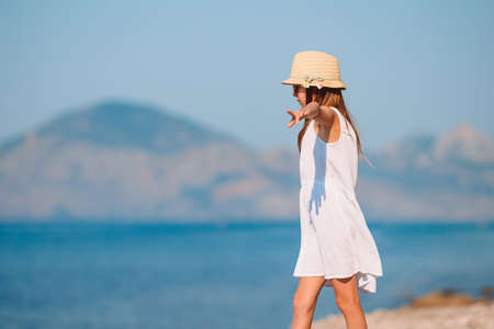 Cute little girl at beach during summer vacationの写真素材