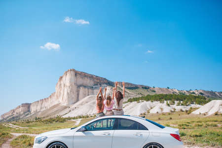 Happy family of three in the mountains