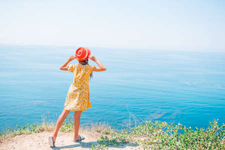 Kid on vacation on white rock backgroundの写真素材
