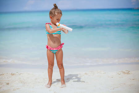 Cute little girl at beach during summer vacationの写真素材