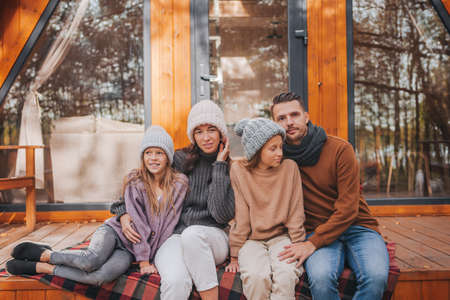 Beautiful family walking at autumn warm day
