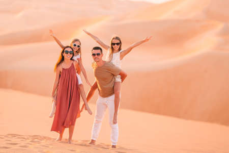 People among dunes in Rub al-Khali desert in United Arab Emiratesの写真素材