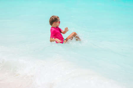 Cute little girl at beach during caribbean vacationの写真素材