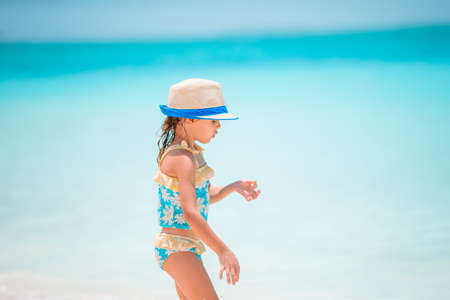 Cute little girl at beach during caribbean vacation