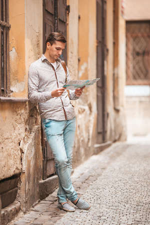 Carefree young man searching for place of destination