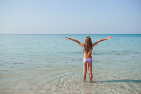 beautiful girl having fun on tropical seashoreの写真素材