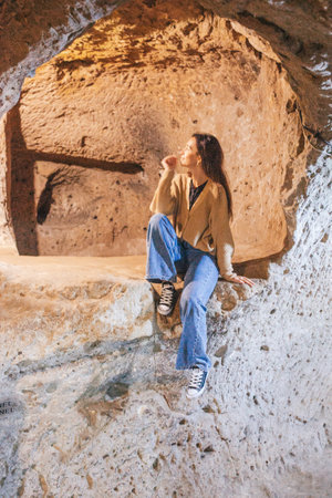 Woman inside old historical turkish dwelling in Turkey. People, travel and history and culture concept.の写真素材