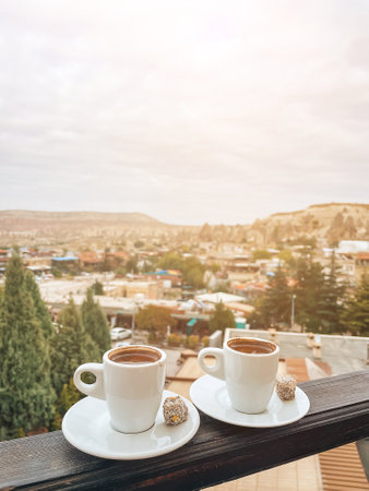 Cup with traditional Turkish coffee on a background of a valley in Cappadocia, Turkey.の写真素材