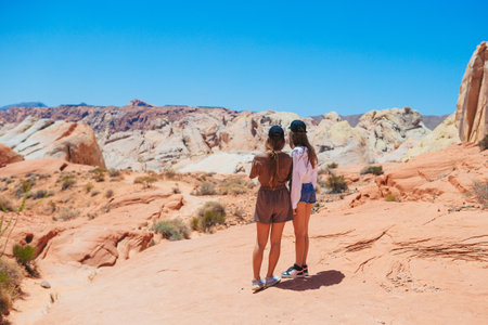 Little girls on trail at Fire Valley in Utahの写真素材