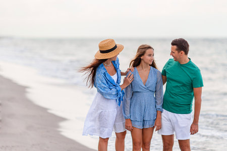 Happy family on the beach during summer vacationの写真素材