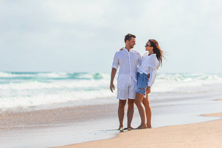 Young couple on white beach during summer vacation.の写真素材